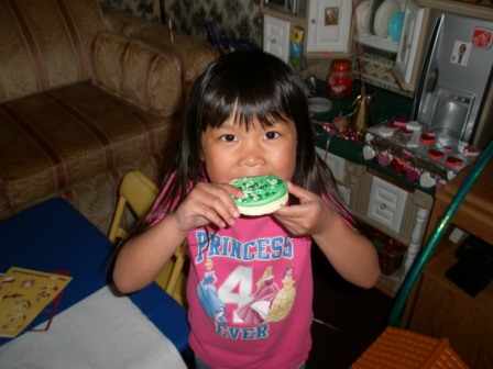 Kasen eating a St. Patrick's cookie